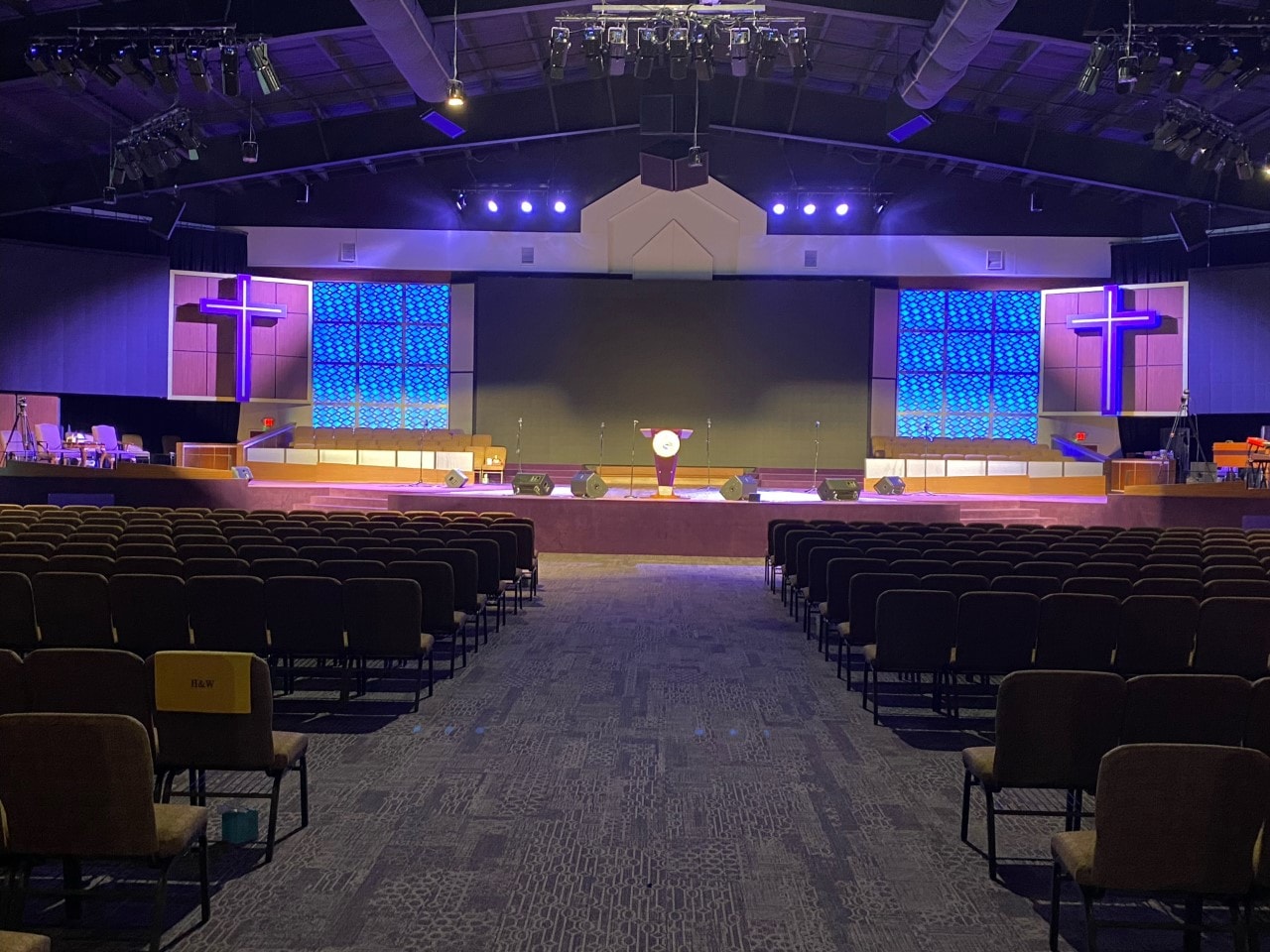 Large sanctuary with purple stage lighting