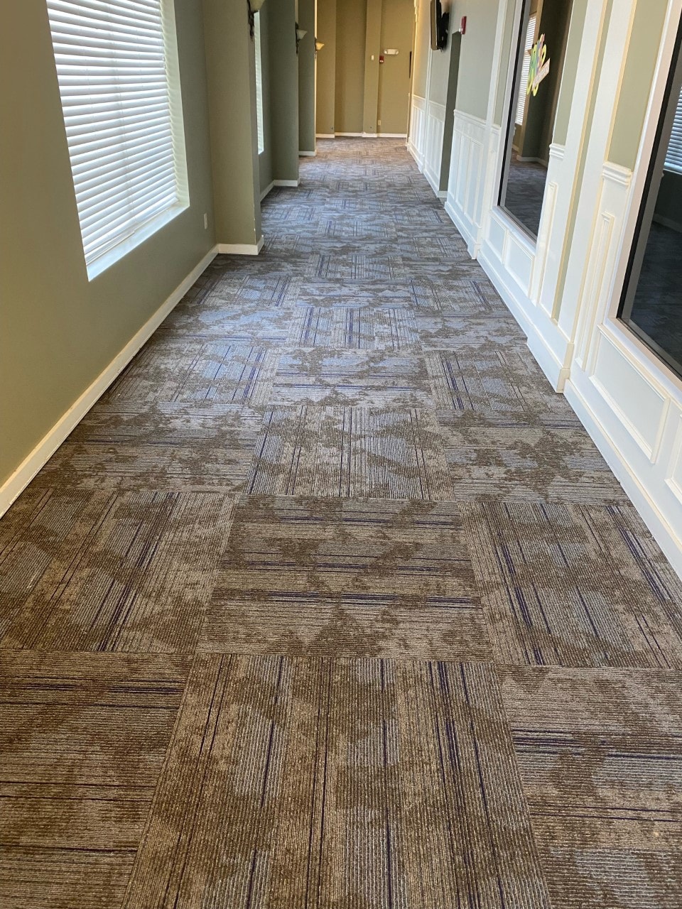 Office corridor with patterned carpet tile