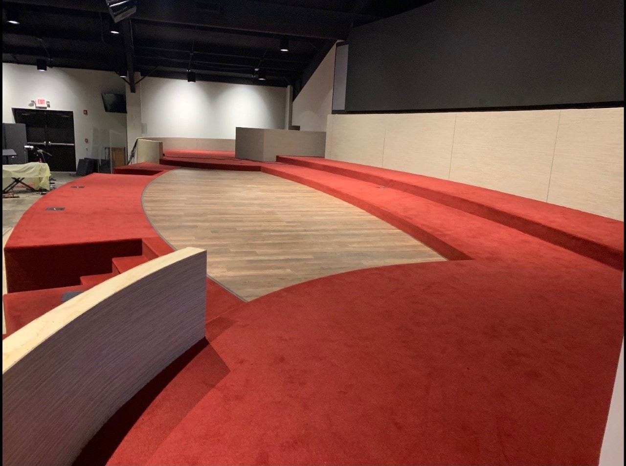 Church stage with red carpet risers and LVP center platform